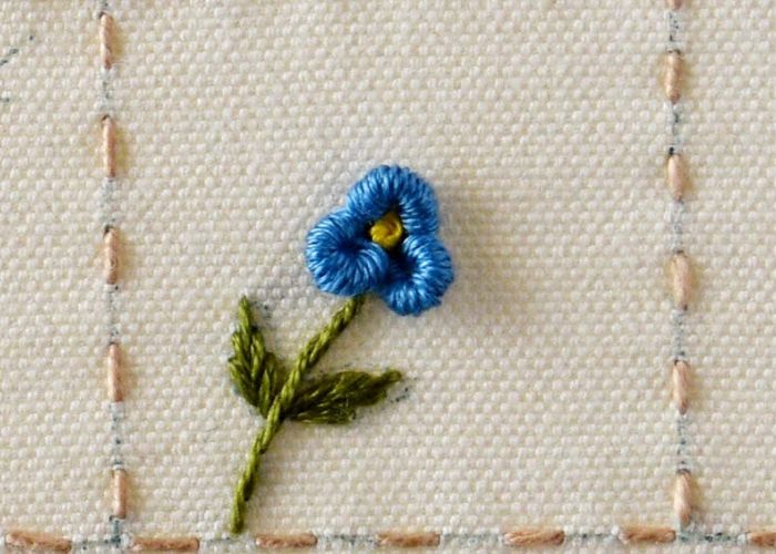 Wie man eine Blume mit Anlagestich stickt: Vergiss mich nicht Schritt 3